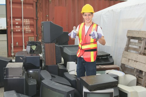 Marked hazardous waste segregation at a skip hire site