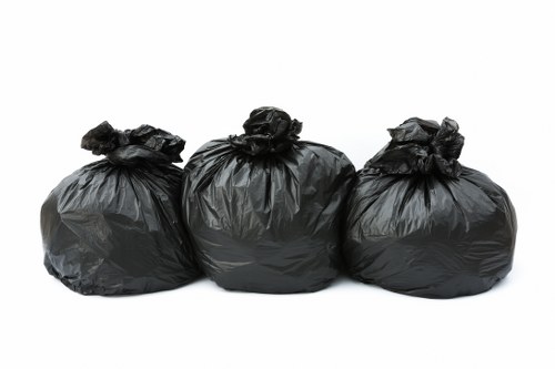 Business owner managing waste with commercial skip hire