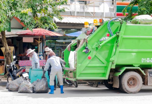 Workers sorting recycling at a central London skip site